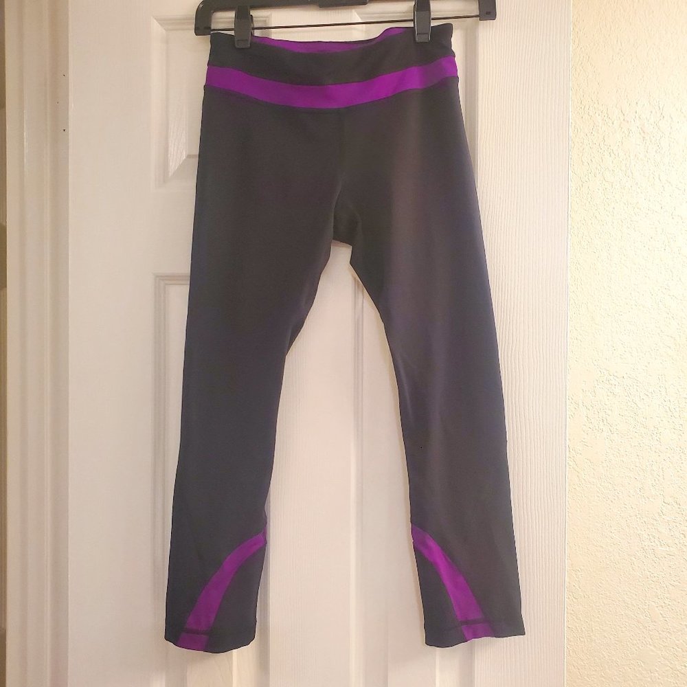 Lululemon black cropped leggings w/ purple stripes; size 4